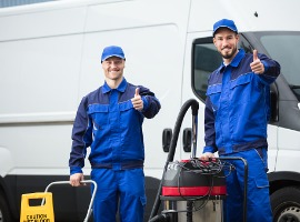 portrait of two happy male janitors