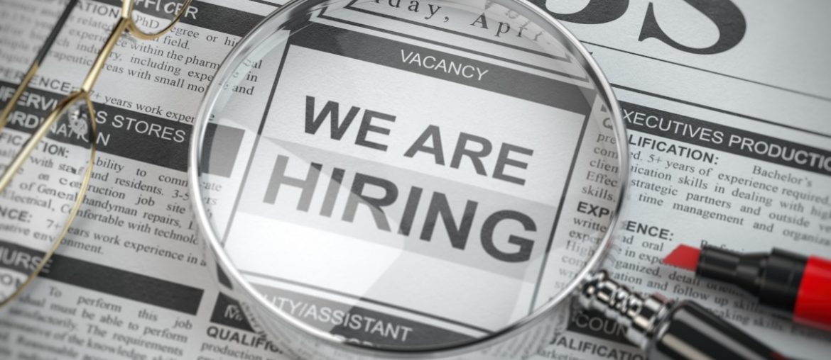 we are hiring job search and employment concept magnified glass with picture