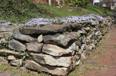 Irregularly Shaped Stones Used for Retaining Wall