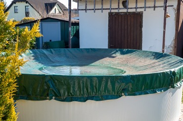 covered pool in the garden picture