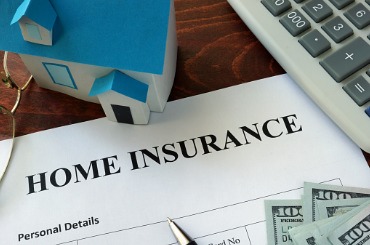 home insurance form and dollars on the table picture