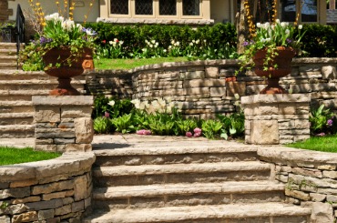 natural stone landscaping of walls and steps outside house picture