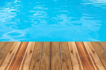 swimming pool and wooden deck ideal for backgrounds picture