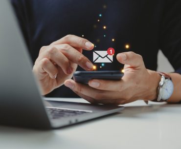 hand of businessman using smartphone for email with notification picture