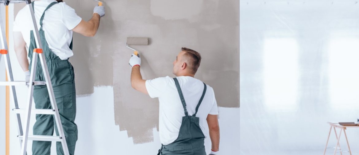 man on ladder painting wall picture