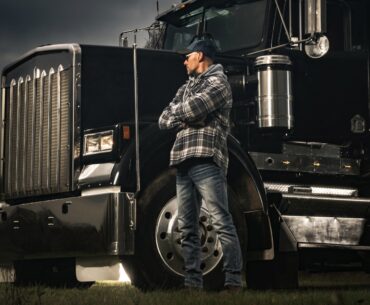 american transportation industry theme with trucker and his semi truck