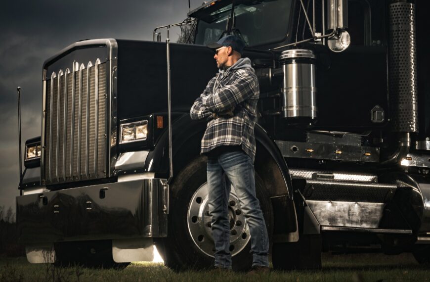 american transportation industry theme with trucker and his semi truck