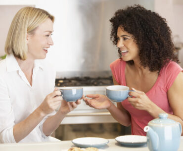 Two women chatting while drinking tea