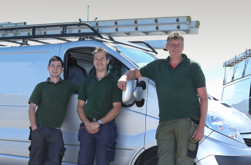 field service workers standing by van