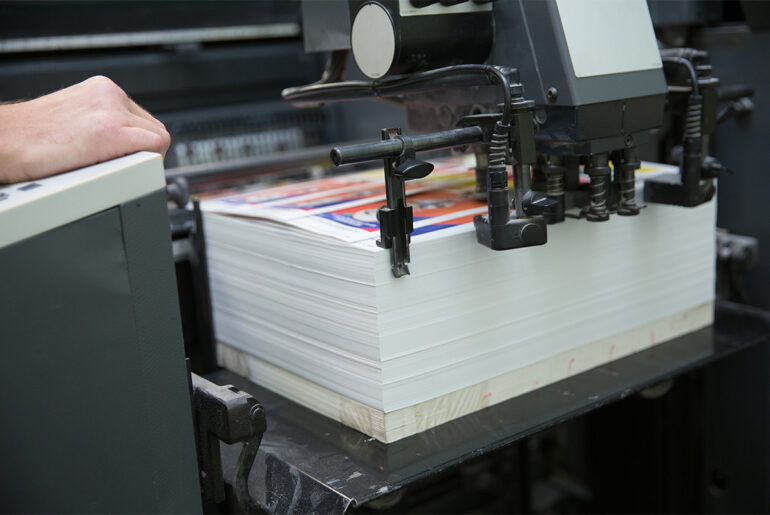 Turning Postcards Into Profits: A Guide for Lawn Care and Pest Control Business Owners stack of postcards